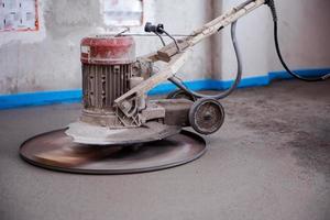 professional machine for performing and polishing sand and cement screed floor photo
