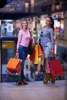 happy young girls in  shopping mall photo