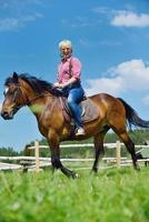 happy woman  on  horse photo