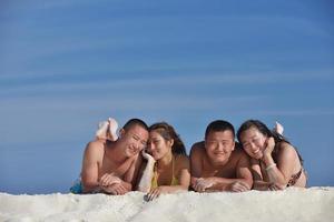 group of happy young people have fun on bach photo