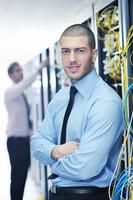 it engineers in network server room photo