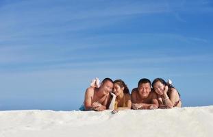 group of happy young people have fun on bach photo