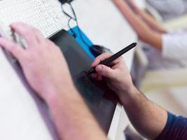 Closeup of Graphic Designer Working at Workplace photo