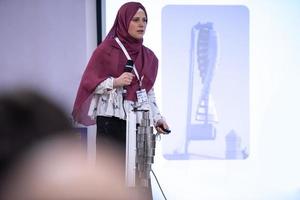 Muslim businesswoman giving presentations at conference room photo