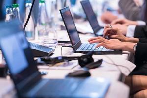 close up of business people hands using laptop computer photo