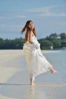 asian bride on beach photo