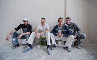 portrait of Workers and builders with dirty uniform in apartment photo