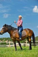 happy woman  on  horse photo