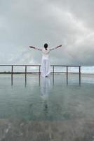 young woman relax on cloudy summer day photo