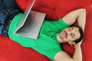 man relaxing on sofa photo