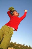 girl with grape outdoor photo