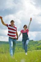 Portrait of romantic young couple smiling together outdoor photo