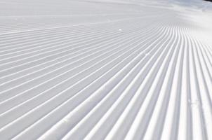 tracks on ski slopes at beautiful sunny  winter day photo