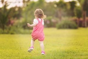 little girl spending time at backyard photo