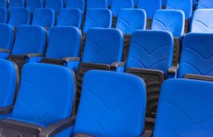 hall with rows of blue seats photo