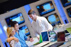 People in electronics store photo