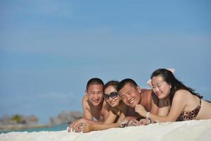 group of happy young people have fun on bach photo