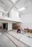 worker installing the ceramic wood effect tiles on the floor photo