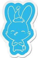 curious bunny cartoon  sticker of a wearing santa hat vector