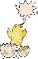 cartoon bird hatching from egg and speech bubble in retro texture style vector