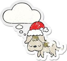 cute christmas dog and thought bubble as a distressed worn sticker vector