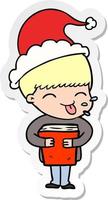 sticker cartoon of a boy wearing santa hat vector