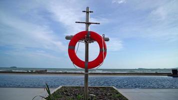 lifebuoy ring near swimming pool with sea background video