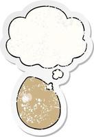 cartoon egg and thought bubble as a distressed worn sticker vector