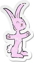 retro distressed sticker of a cartoon rabbit vector