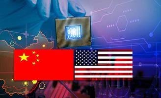 Chip shortage and US-China trade conflict. Global chip shortage crisis and China-United States trade war concept. China flag and US flag on china map and hand holding computer chip on background. photo