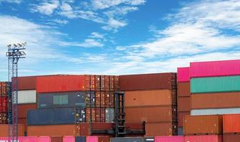 Stack of logistics container. Cargo and shipping business. Container ship for export logistics. Logistic industry. Container for truck, ship, and air logistics. Container depot service and transport. photo