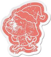 cartoon distressed sticker of a elephant remembering wearing santa hat vector