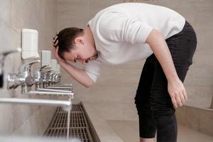 A Muslim takes ablution for prayer. Islamic religious rite photo