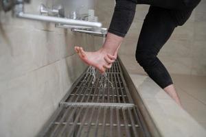 A Muslim takes ablution for prayer. Islamic religious rite photo