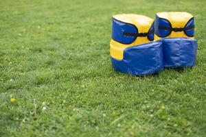 Funny shoes of blue color. Equipment for playing outdoors. It's ridiculous run. photo