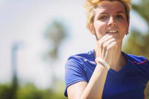 young female runner training for marathon photo