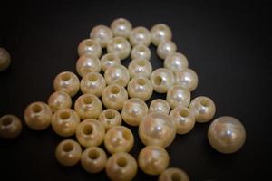 Photos of unique knick knacks made of pearls in perforated