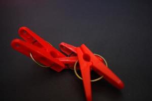 Portrait of a red clothes pin, can be used anytime and anywhere photo