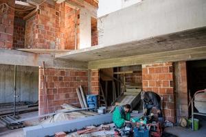 workers on interior of construction site photo