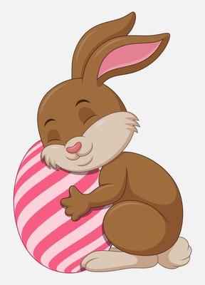 Cute blue Easter Bunny hugged egg decorated isolated on a white background