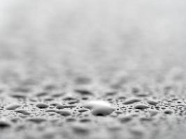 rain drops on blue metal close up macro photo