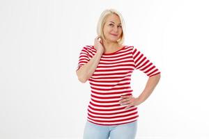 Middle-aged woman posing on white, Snap shot of a cheerful blonde, side pose. White background. photo