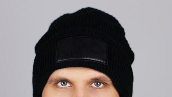 man in blank black winter hat isolated , mock up , copy space photo