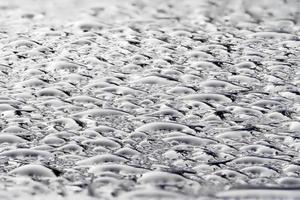 rain drops on blue metal close up macro photo