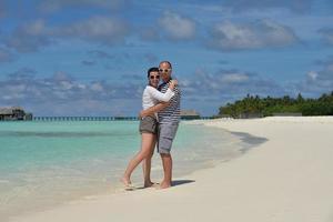 happy young  couple at summer vacation have fun and relax at beach photo