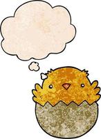 cartoon chick hatching from egg and thought bubble in grunge texture pattern style vector