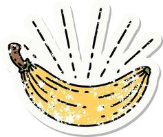 worn old sticker of a tattoo style banana vector