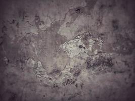 Old Wall damaged with blown Plaster and paint clog,peeling paint damage,water damage on building wall.Grunge abstract background.Wall fragment with scratches and cracks.Old distressed wall backdrop. photo