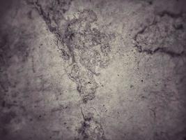 Old Wall damaged with blown Plaster and paint clog,peeling paint damage,water damage on building wall.Grunge abstract background.Wall fragment with scratches and cracks.Old distressed wall backdrop. photo