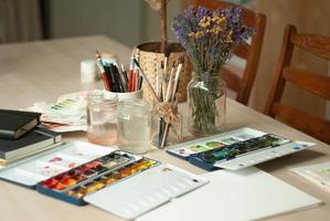 Art painting process on table photo
